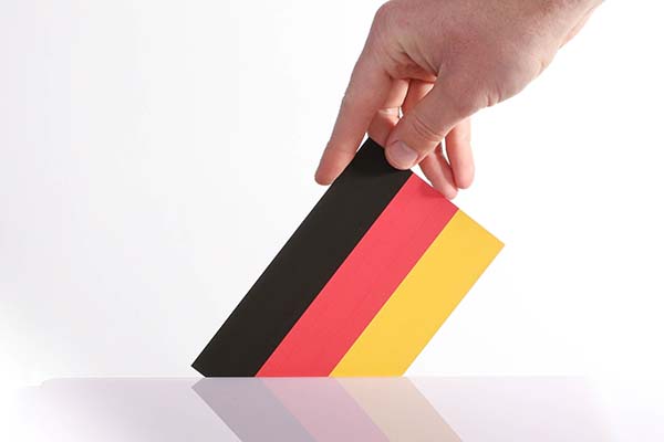 Hand holding German flag. Photo: Marco Verch Professional Photographer (CC BY 2.0)