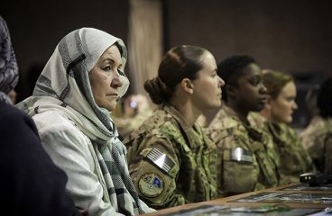 Women with the Afghan National Army Air Force (ANAAF) and International Force listen during an International Women’s Day celebration in Kabul. Photo: Sgt. Dustin Payne / DoD / Public domain.
