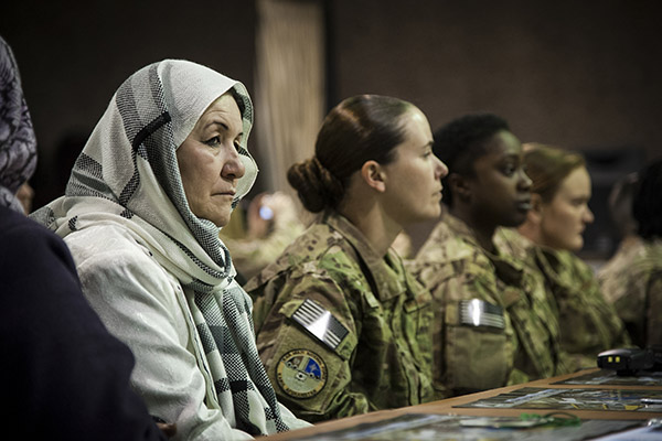 Women with the Afghan National Army Air Force (ANAAF) and International Force listen during an International Women’s Day celebration in Kabul. Photo: Sgt. Dustin Payne / DoD / Public domain.