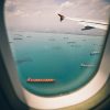 Cargueros en la costa desde la ventanilla de un avión. Foto: Fancy Crave en Unsplash