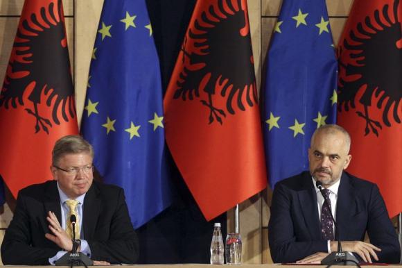 (EU Enlargement Commissioner Stefan Fuele (L)  and Albania's Prime Minister Edi Rama. Tirana June 4, 2014. REUTERS/Arben Celi)