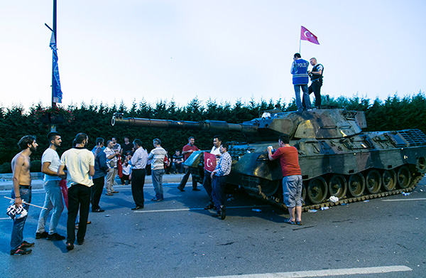 Turkey’s coup: the first one that failed. Protesters standing in front of a tank last Saturday near Istanbul airport.