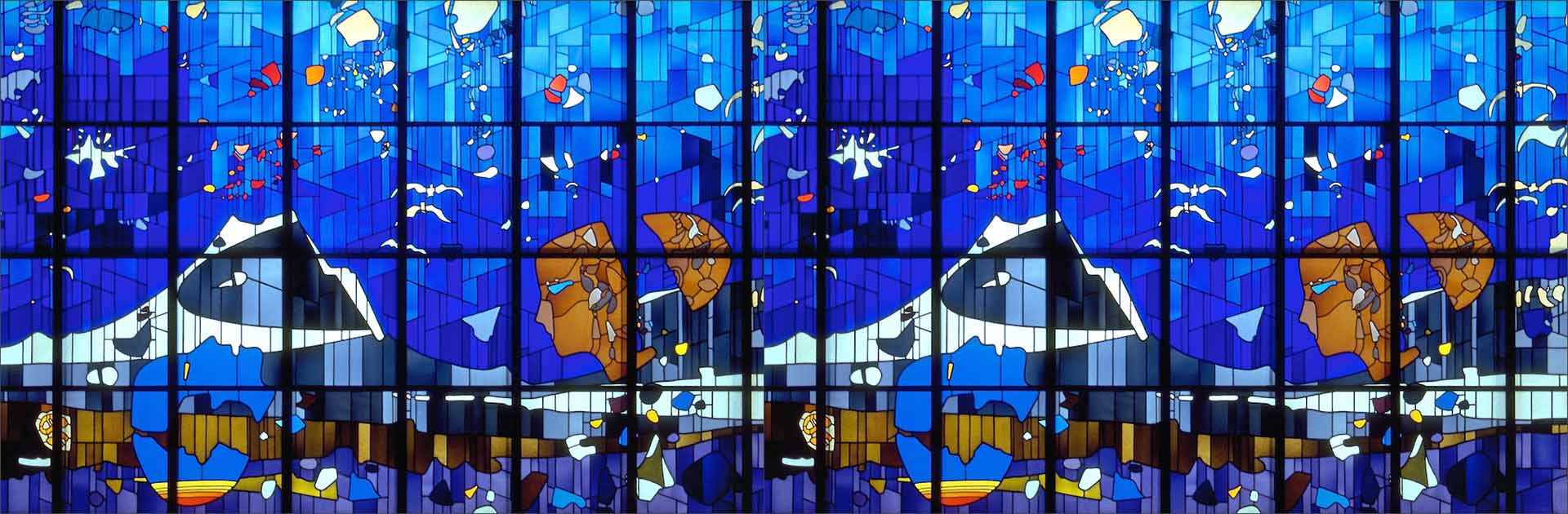 Latin America. Photo composition of the stained-glass window “El nacimiento del hombre” by Héctor Poleo, taken in 1995 at the metro station La Paz in Caracas, Venezuela