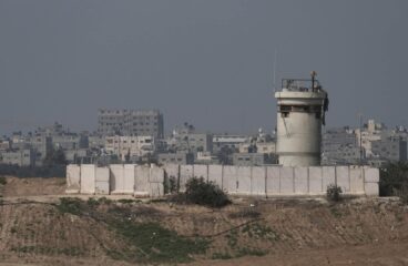 Gaza border with Israel. Distant view of residential houses and buildings in the northern part of the Gaza strip across an Israeli army post