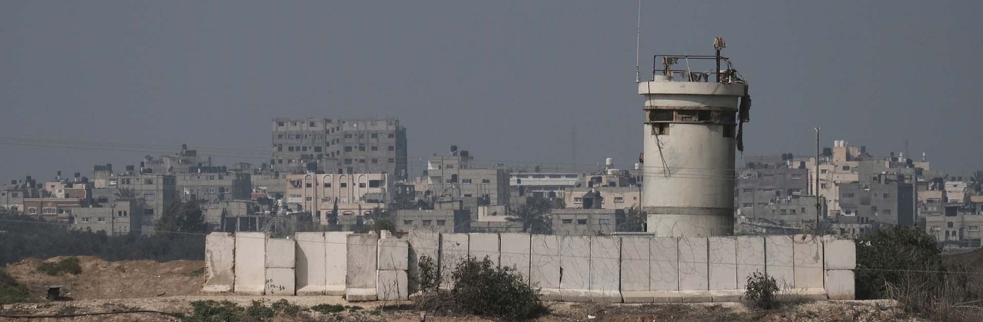 Gaza border with Israel. Distant view of residential houses in the northern part of the Gaza strip across an Israeli army post