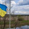 Flag of Ukraine waving on a bridge over the Irpin river, next to Hostomel, on the outskirts of Kyiv
