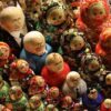 A set of matryoshka dolls displayed diagonally at a market in St. Petersburg, Russia. In the center the dolls with images of the leaders of Russia and the USSR