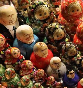 A set of matryoshka dolls displayed diagonally at a market in St. Petersburg, Russia. In the center the dolls with images of the leaders of Russia and the USSR