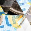 Abstract triangle mosaic background with one-euro coins and 20-euro banknotes. Conceptual representation of the European economic model