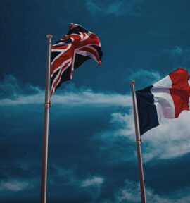 UK and French flags waving. Elections France UK