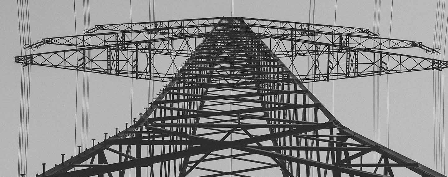 Electrical transmission tower from low angle. Geopolitics of the global energy