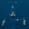 Array of aircraft carriers and aircraft in the ocean. Multilateral export controls