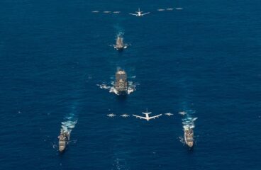 Array of aircraft carriers and aircraft in the ocean. Multilateral export controls