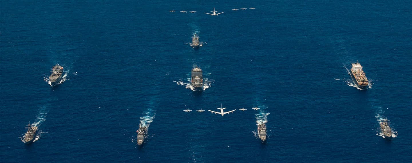 Array of aircraft carriers and aircraft in the ocean. Multilateral export controls