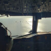 Daytime view from the cockpit of an aircraft of 4 Spanish Navy ships in a demonstration of the European Union naval force Operation Atalanta, with calm seas and partly cloudy skies