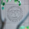 Close-up of the International Monetary Fund (IMF) logo engraved on the façade of its headquarters building in Washington (USA). IMF