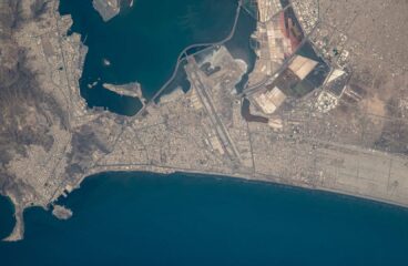 Overhead satellite view of Aden (Yemen), showing a top-down perspective of the city’s natural harbour. Houthi