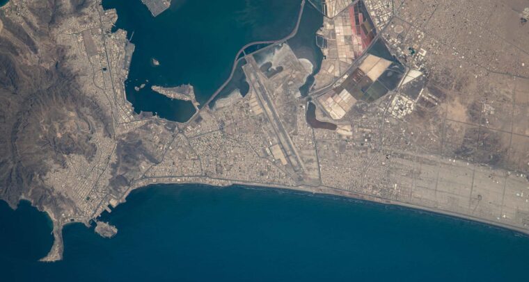 Overhead satellite view of Aden (Yemen), showing a top-down perspective of the city’s natural harbour. Houthi