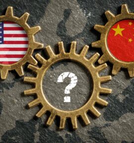 Three golden interlocking gears over a map of Europe on a dark textured background. The left gear features the US flag, the right gear shows the Chinese flag, and the bottom gear features a white question mark.