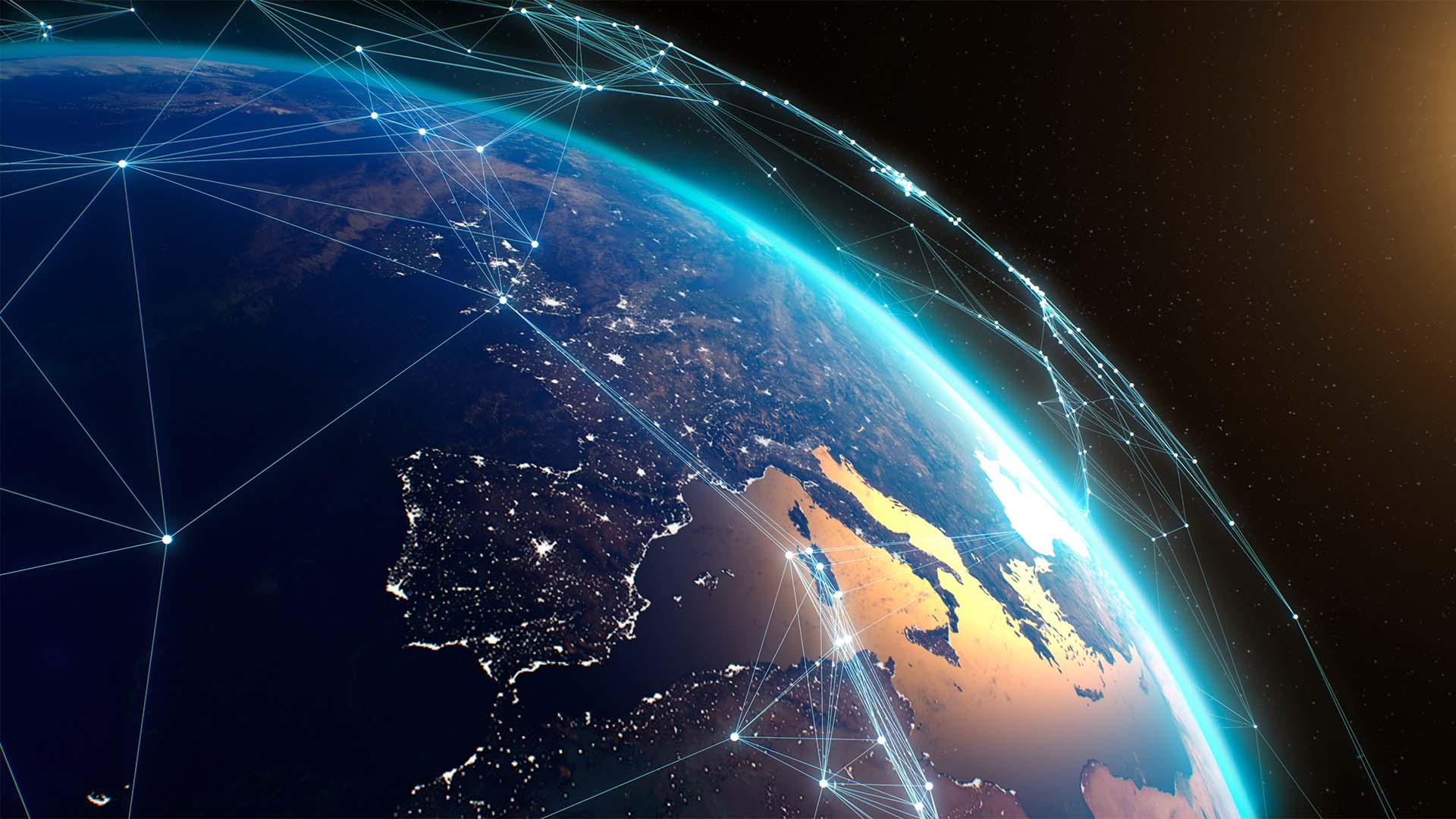 Imagen del planeta Tierra vista desde el espacio, centrada en Europa, el norte de África y Oriente Medio. Sobre la superficie aparecen líneas y puntos luminosos que conectan distintas regiones, formando una red que sugiere conexiones globales. Parte del planeta está iluminada por el sol desde la derecha, mientras el fondo es oscuro con estrellas.
